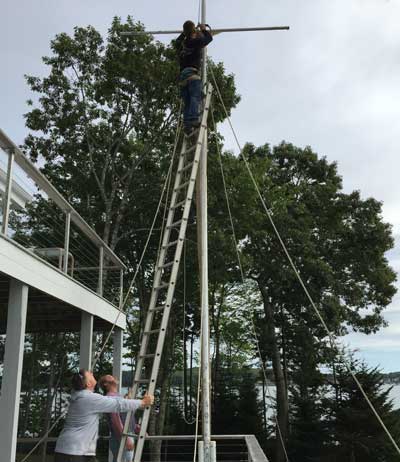 Person repairing flagpole